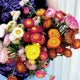 Bouquet of colorful flowers held by a person