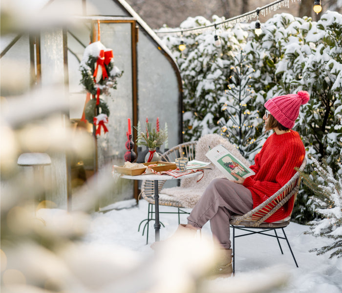 person reading a catalog outside in winter